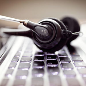 headset-on-a-laptop-computer-keyboard-PELZQNY headset-on-a-laptop-computer-keyboard-PELZQNY